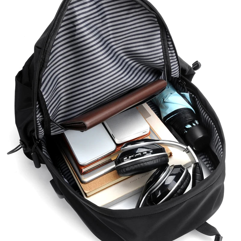 Simple solid color backpack with laptop compartment and USB charging port, suitable for travel, commuting, school, business