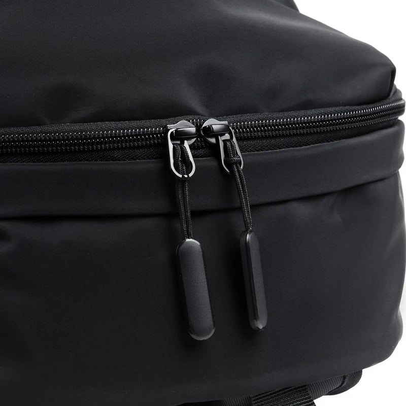 Simple solid color backpack with laptop compartment and USB charging port, suitable for travel, commuting, school, business