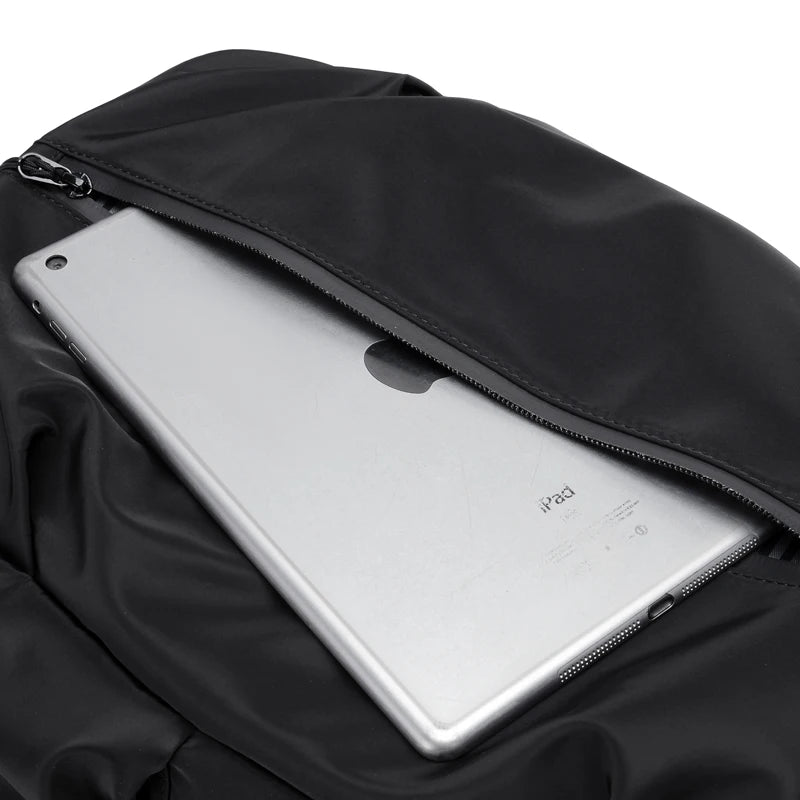 Simple solid color backpack with laptop compartment and USB charging port, suitable for travel, commuting, school, business