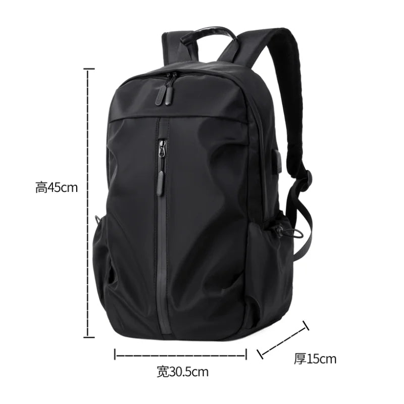Simple solid color backpack with laptop compartment and USB charging port, suitable for travel, commuting, school, business